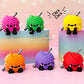 colorful yarn skein fidget clickers on pink background