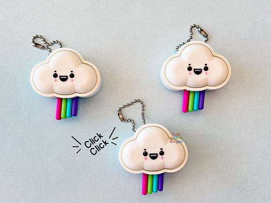 three white cloud fidget clickers with kawaii faces on blue background
