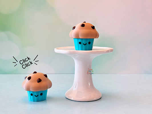 kawaii muffins fidget clicker on a white pedestal with bokeh background